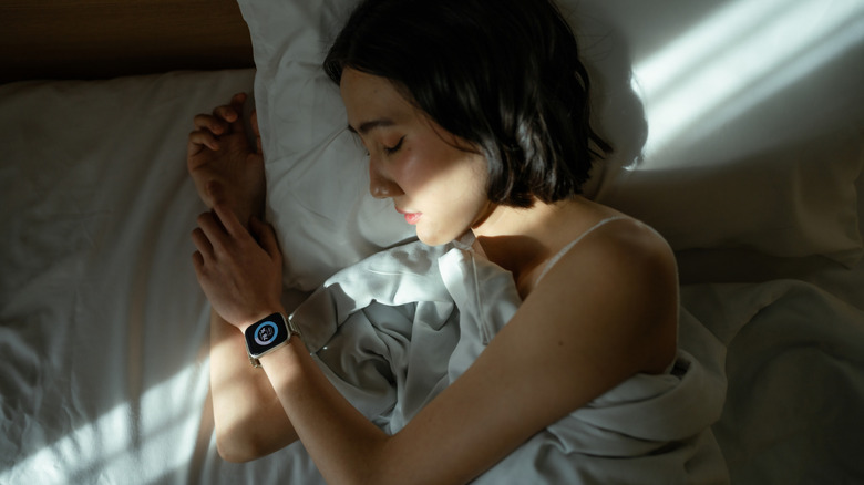 Woman sleeping in a dark room