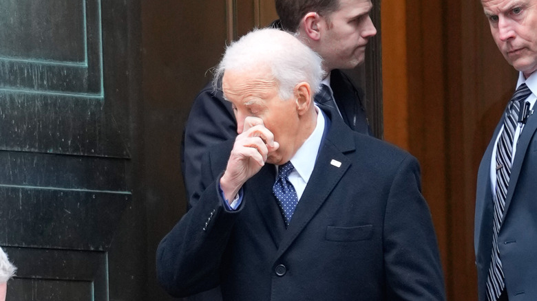 Joe Biden rubbing knuckle on eye