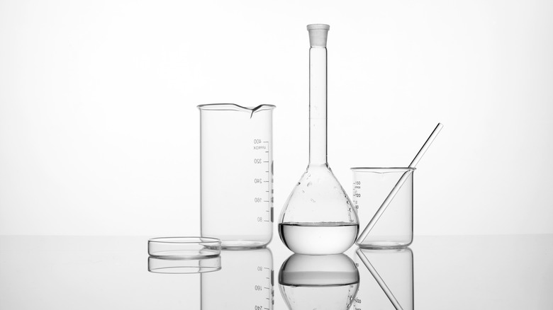 Assorted laboratory glassware on white background
