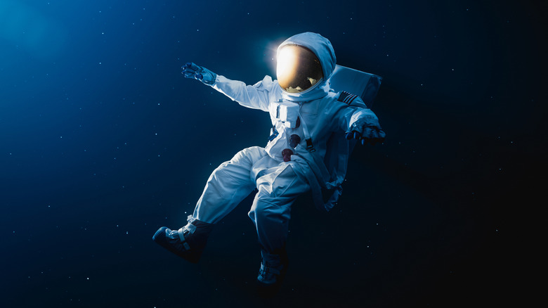 astronaut floating loose in space