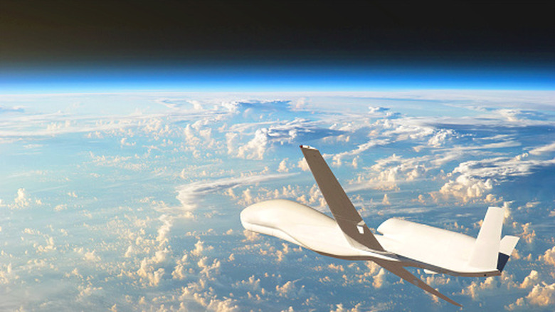A drone flying in low-space orbit above the planet Earth