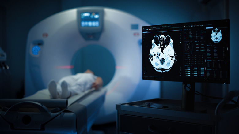 patient receiving brain scan in MRI machine