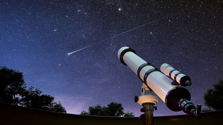 Telescope pointed at the night sky from an observation station