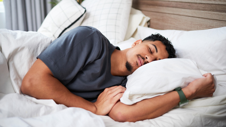 Man sleeping in bed