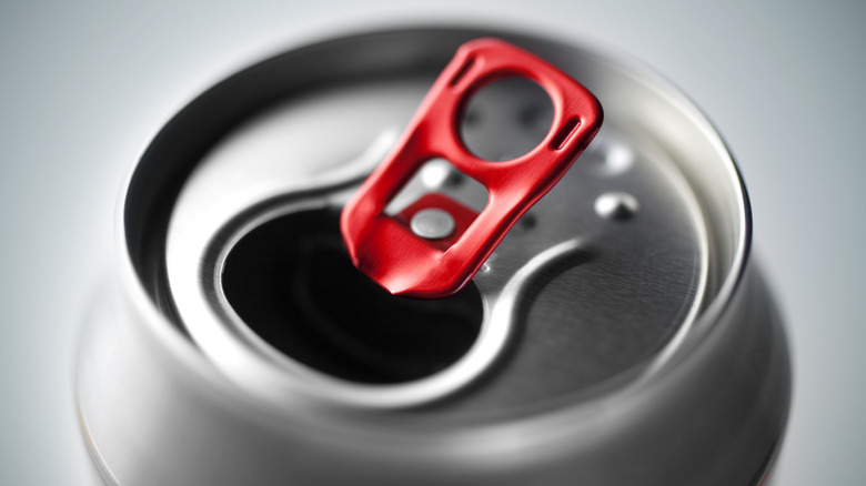 Close up of soda can that has been opened