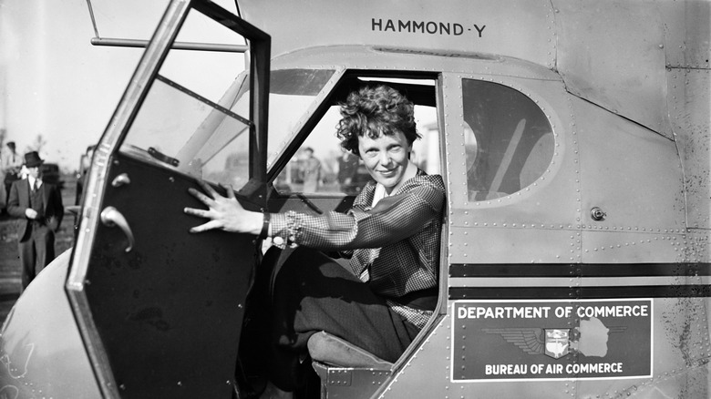 Amelia Earhart in plane cockpit