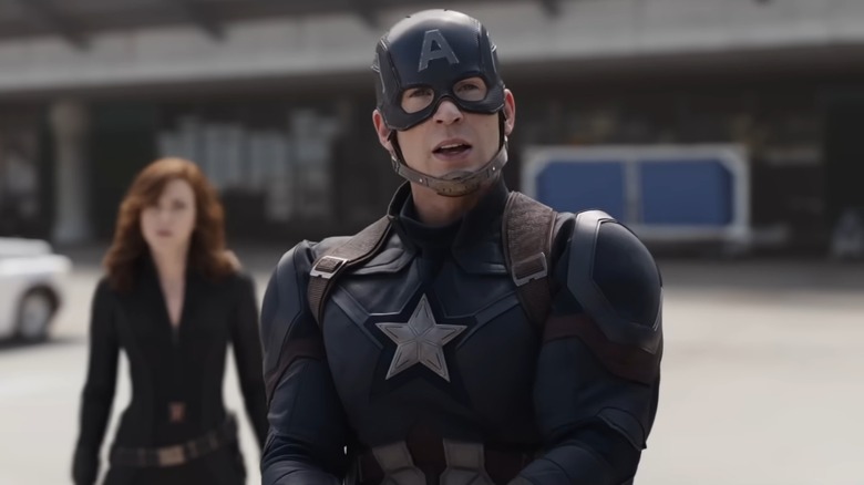 Captain America Steve Rogers in "Captain America: Civil War" with Black Widow standing behind him