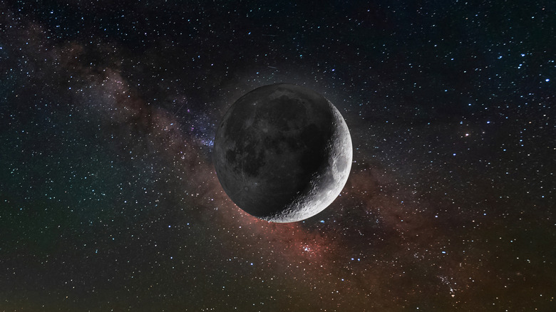 The moon is seen against a starry night sky