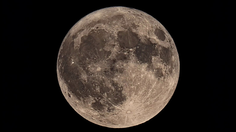 The surface detail of the moon is seen in a shot of the moon against a black sky