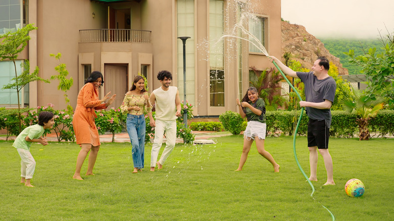 Group of people playing on lawn