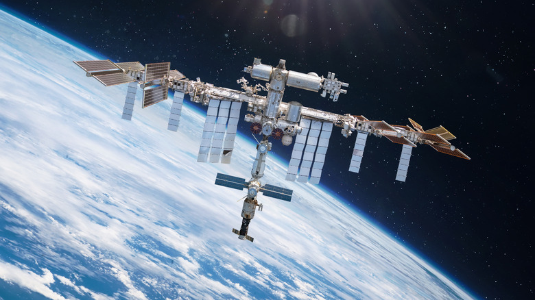 The International Space Station in orbit above the curvature of the Earth