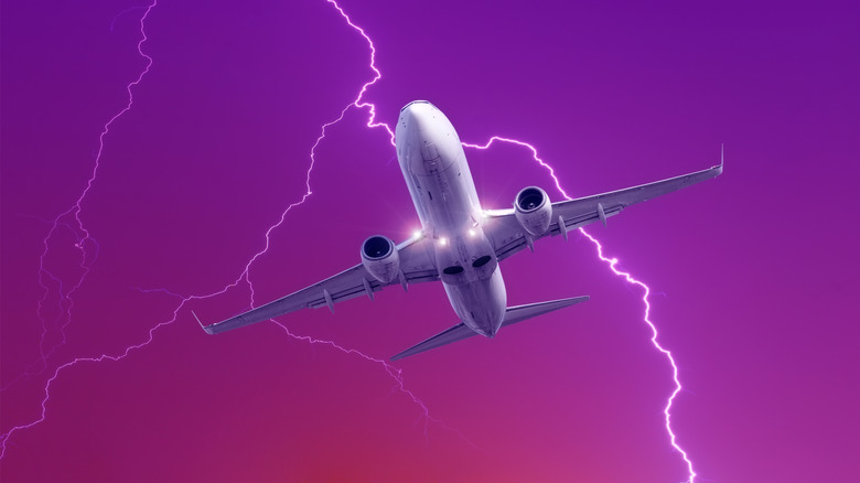 graphic of airplane being struck by lightning against purple sky