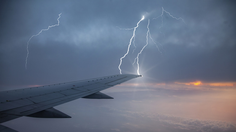 lightning bolt striking airplane wing tip