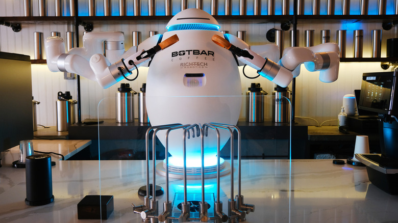 A robot preparing a cup of coffee