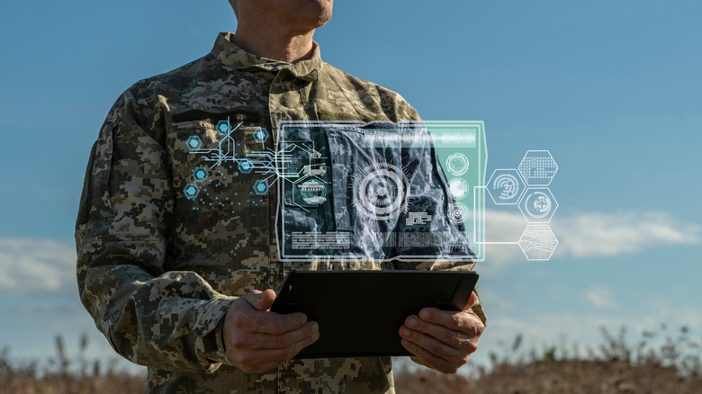 Army commander using artificial intelligence outdoors