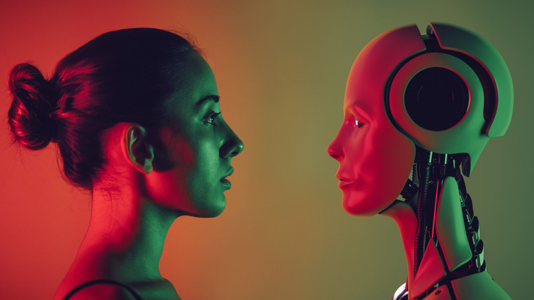 A woman face to face with a robot