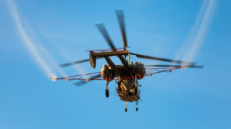 Helicopter spraying pesticides
