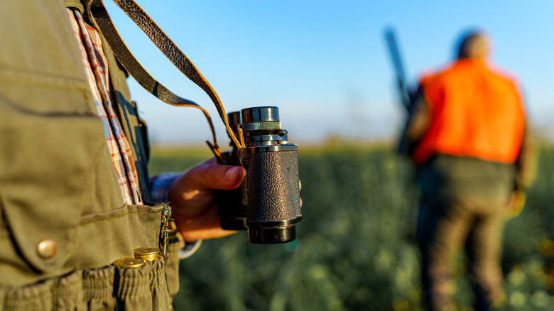 Close-up of a hunter with binoculars