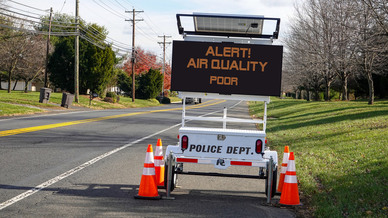 air quality alert road sign
