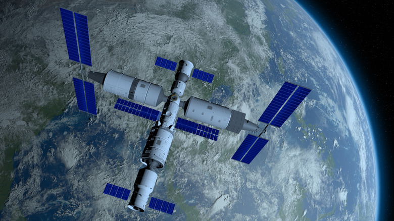 3D illustration of Tiangong space station over Earth