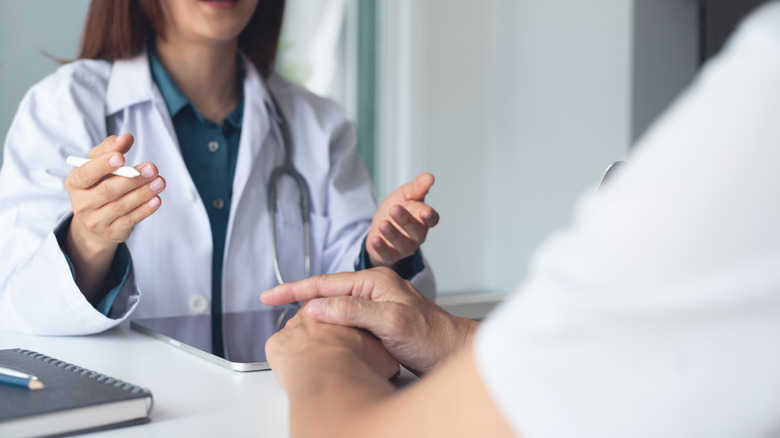 A doctor talking with a patient
