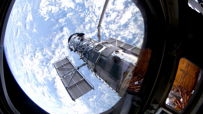 The Hubble Telescope in orbit above the atmosphere