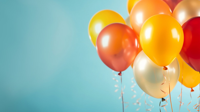 collection of yellow, orange, and gold balloons