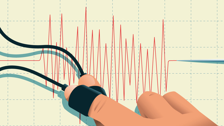 A hang attached to two wires above a polygraph needle