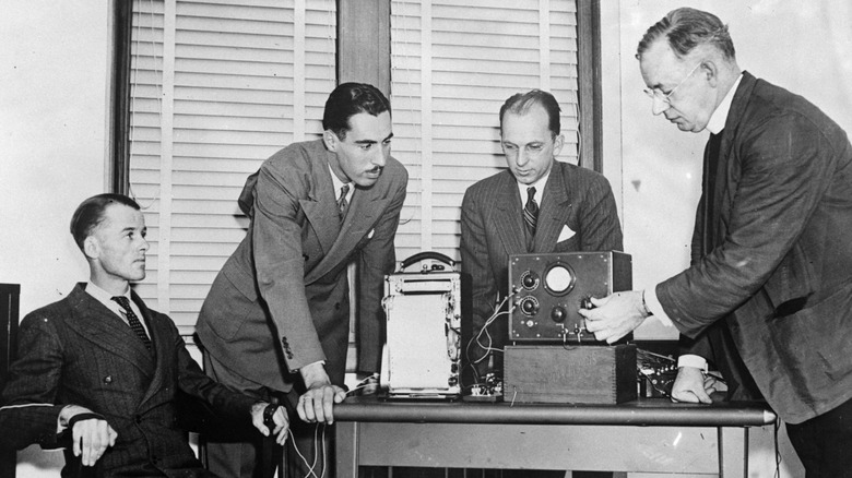 A black an white image of a person taking a lie detector test in 1937