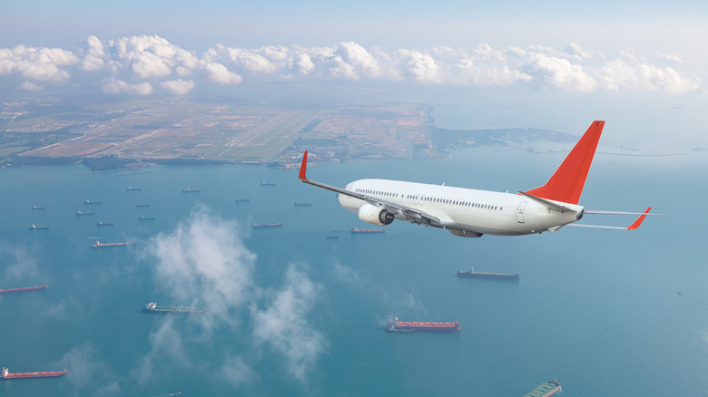 airplane maneuvering towards airport