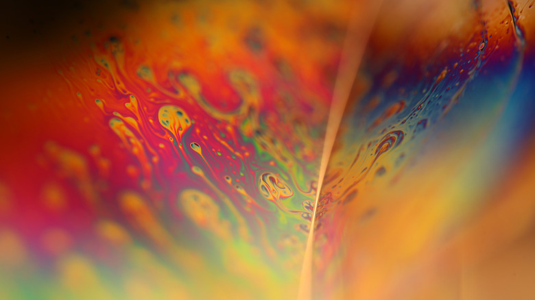 Macro image of a colorful oily liquid surface