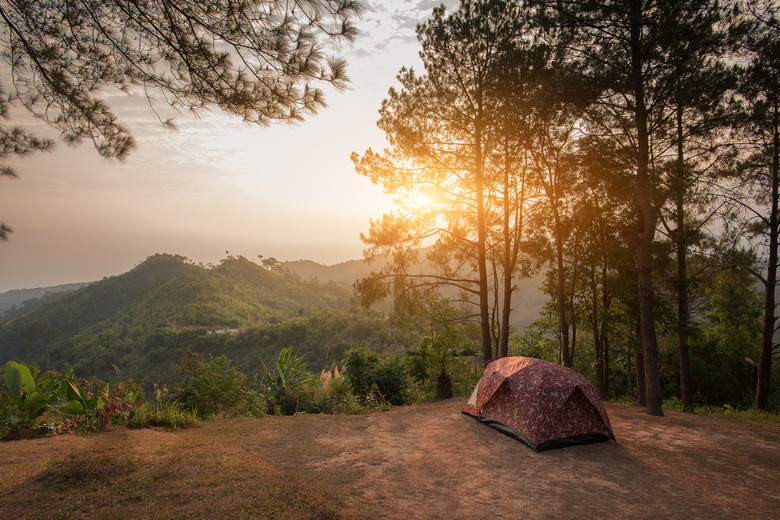 Tents on a hills at sunrise at Taksin Maharach