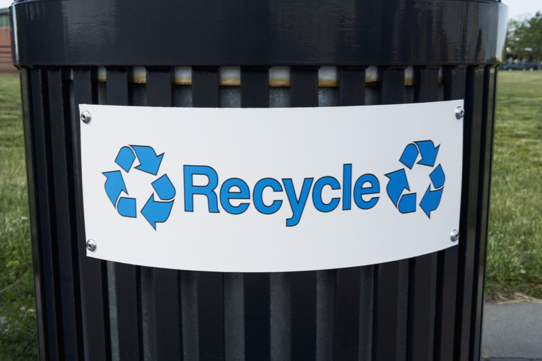 Trash bin with recycle sign