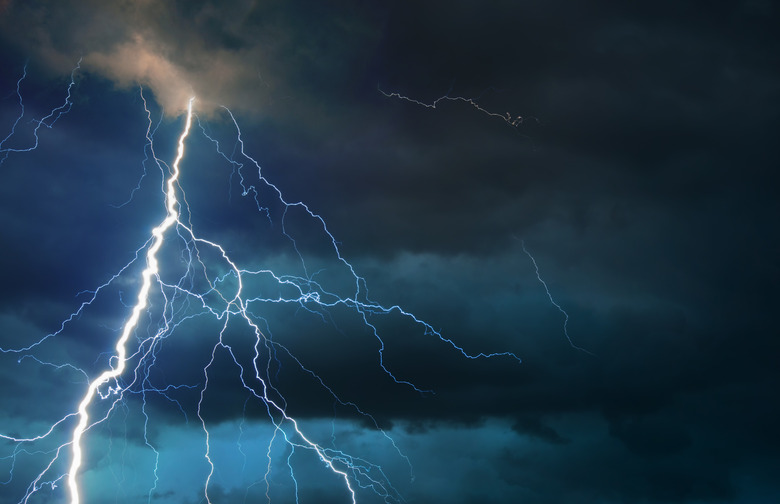 Fork lightning striking down during summer thunderstorm